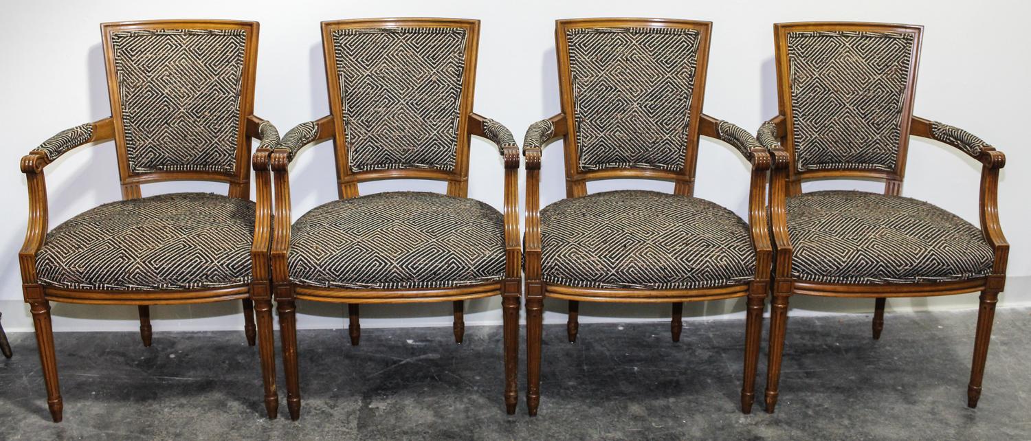 A Set of Four Arm Chairs. Height 36 inches