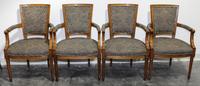 A Set of Four Arm Chairs. Height 36 inches