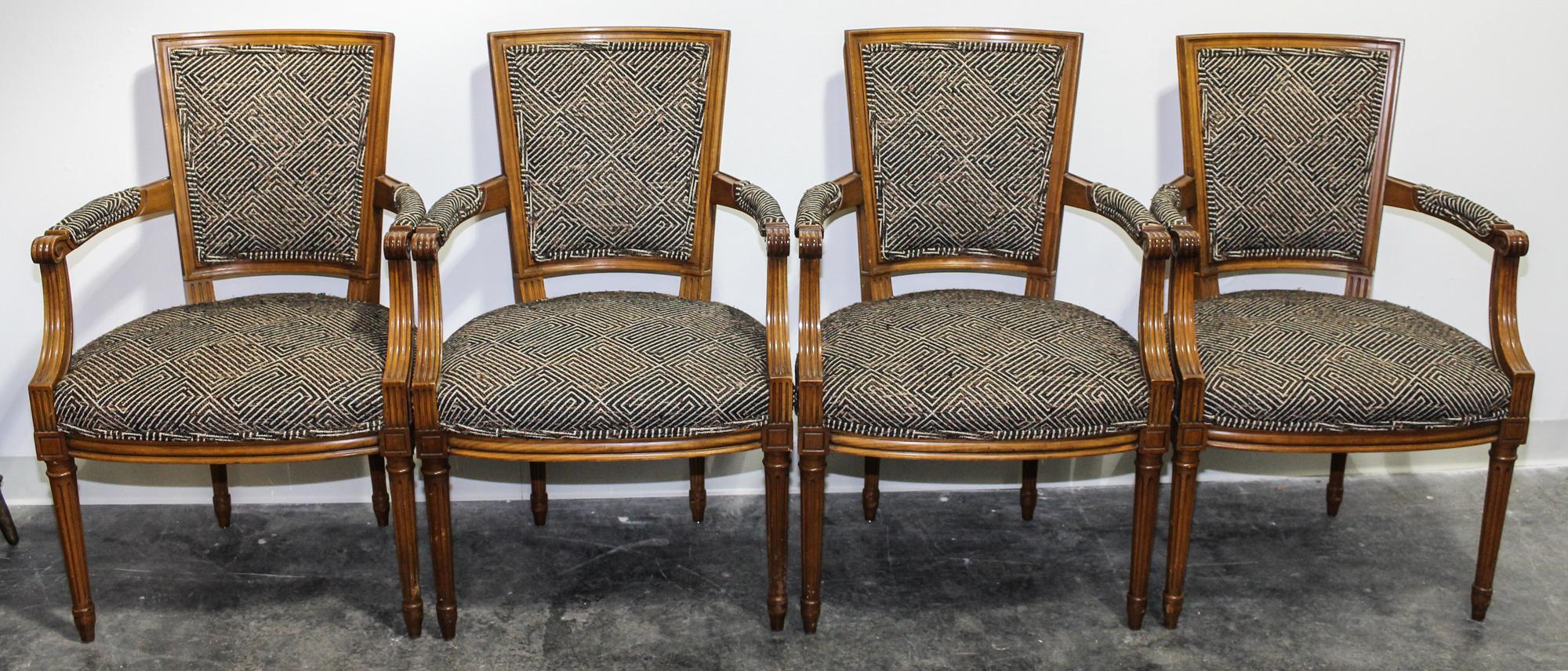 A Set of Four Arm Chairs. Height 36 inches