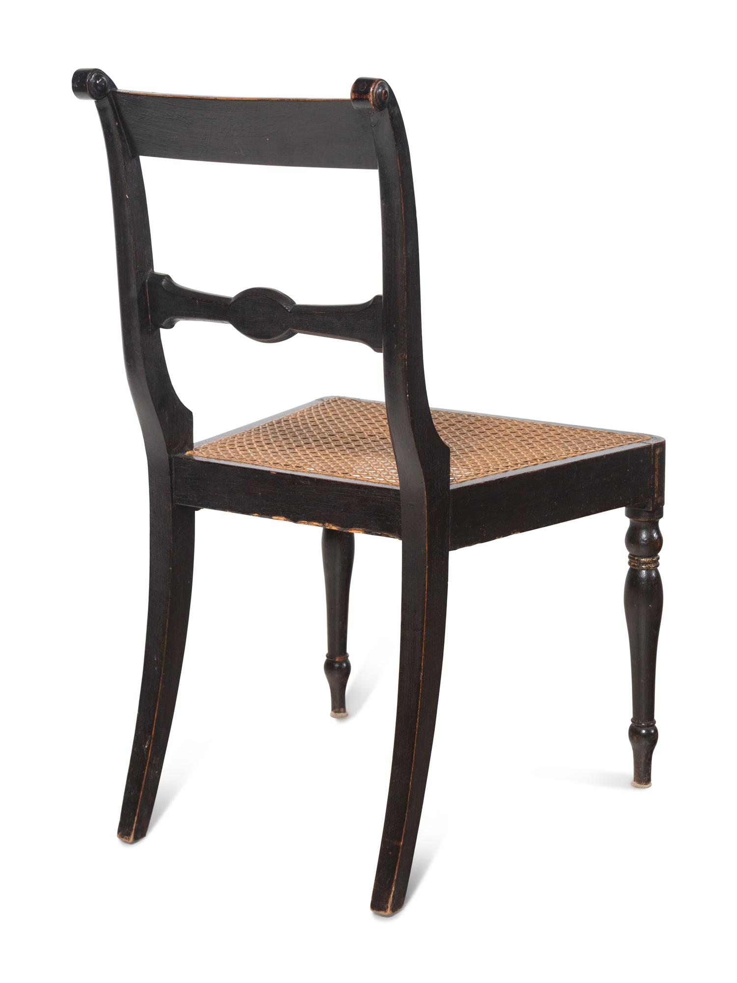 A Set of Five Regency Painted Cane Seat Dining Chairs