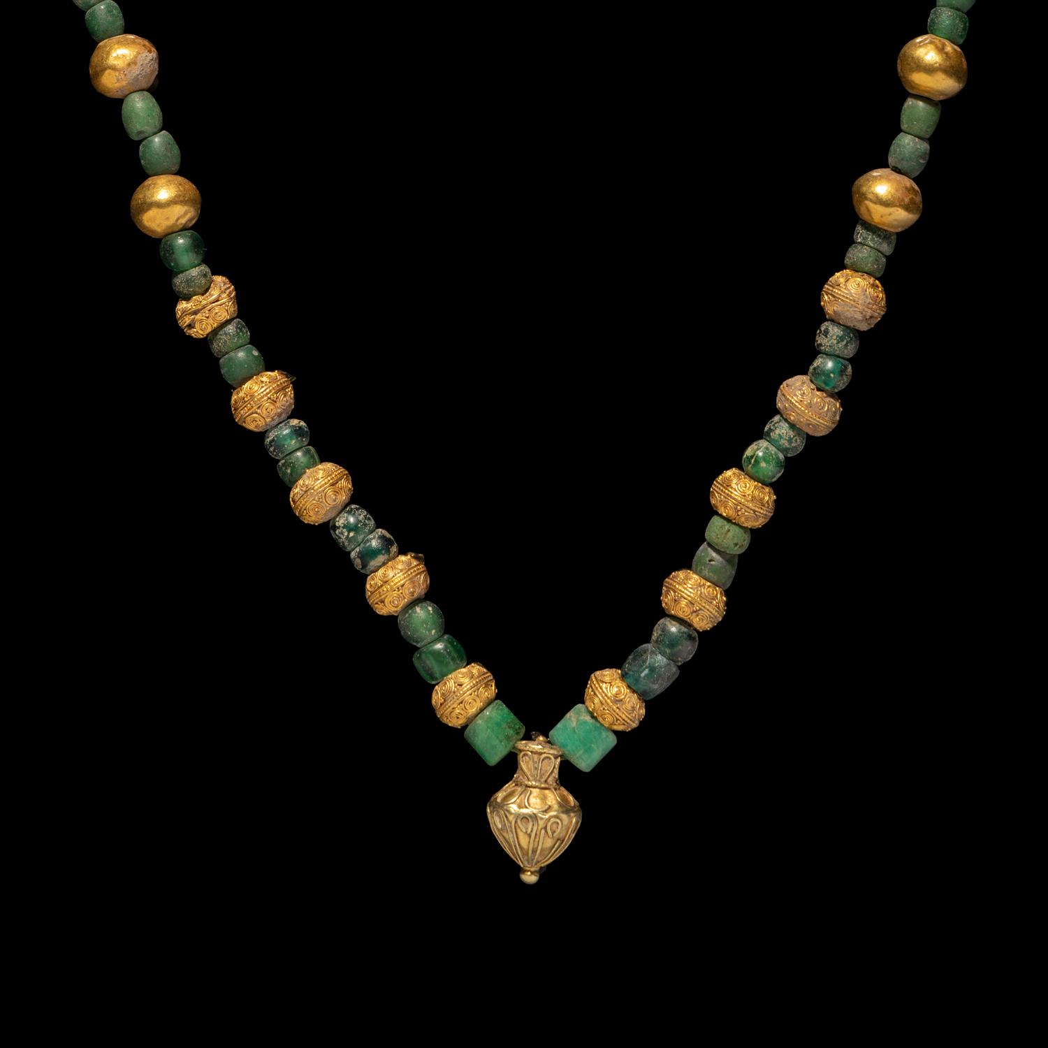 A Greek Gold, Emerald, and Glass Necklace with an Amphora-Shaped Pendant
