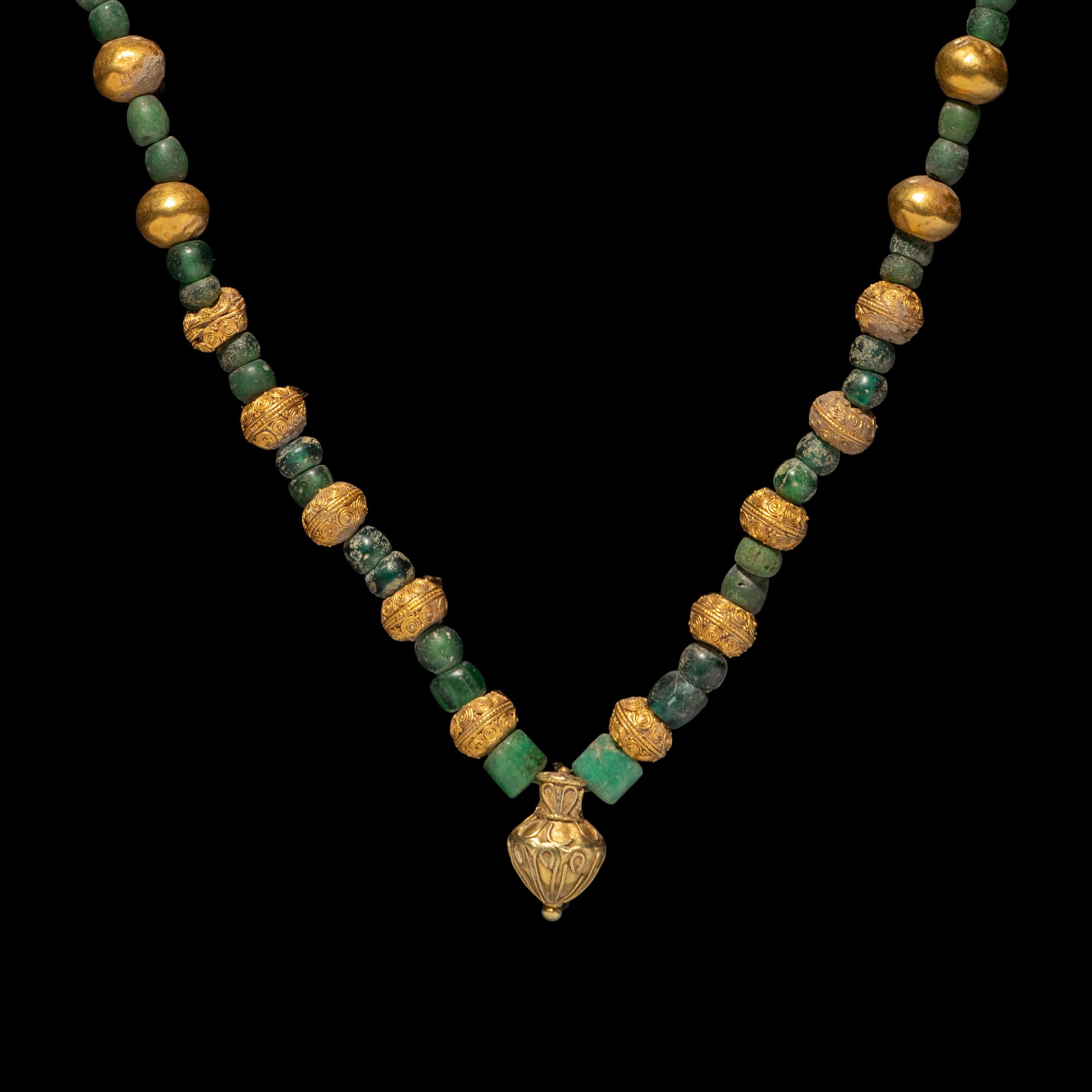 A Greek Gold, Emerald, and Glass Necklace with an Amphora-Shaped Pendant