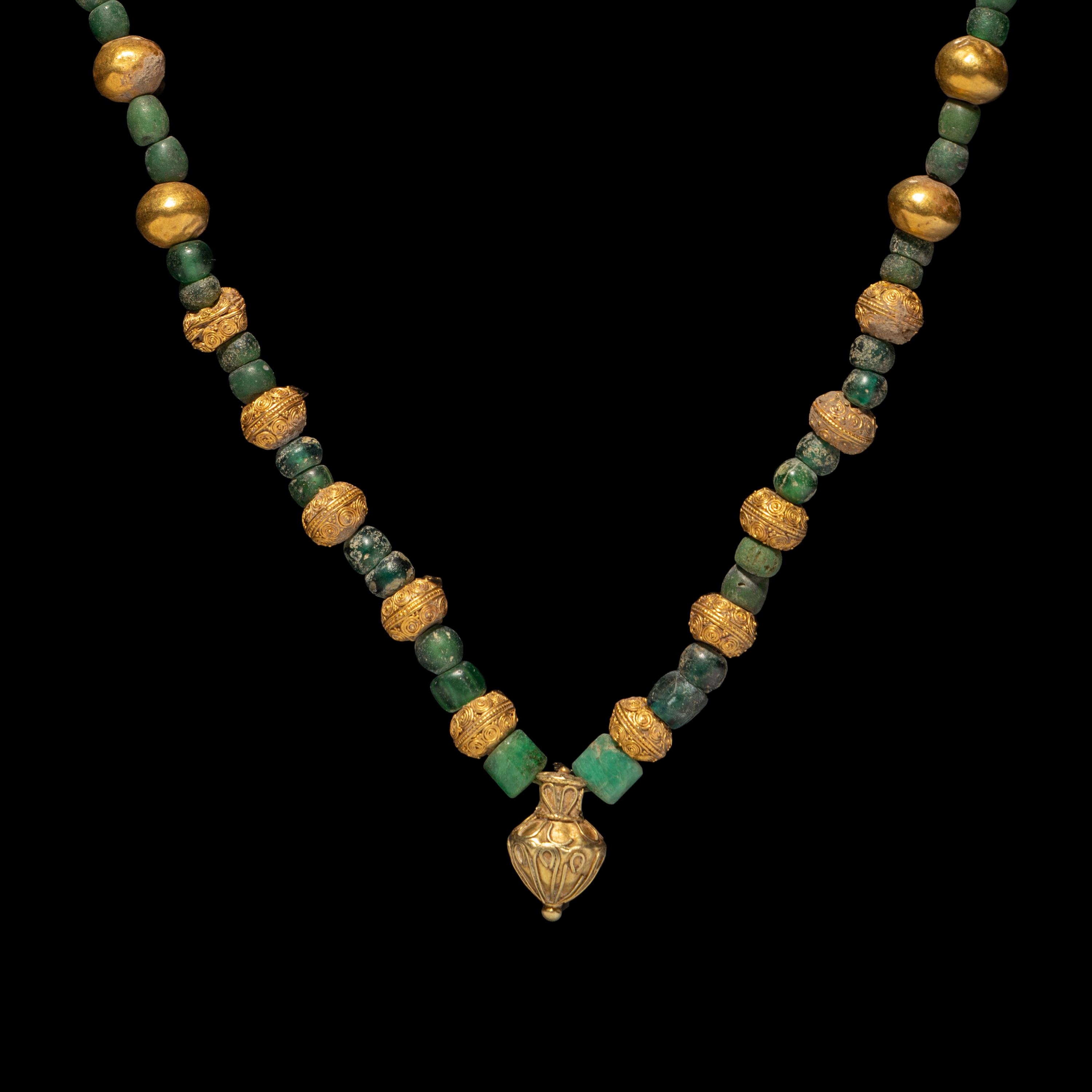 A Greek Gold, Emerald, and Glass Necklace with an Amphora-Shaped Pendant