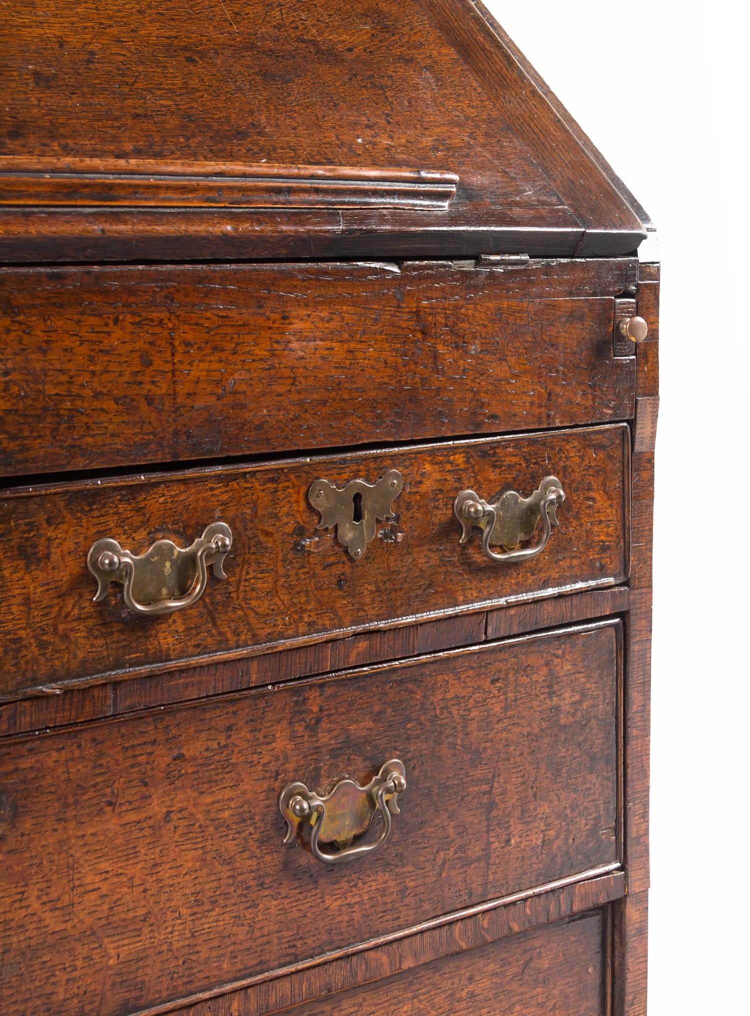 A George III Provincial Oak Slant-Front Secretary Desk