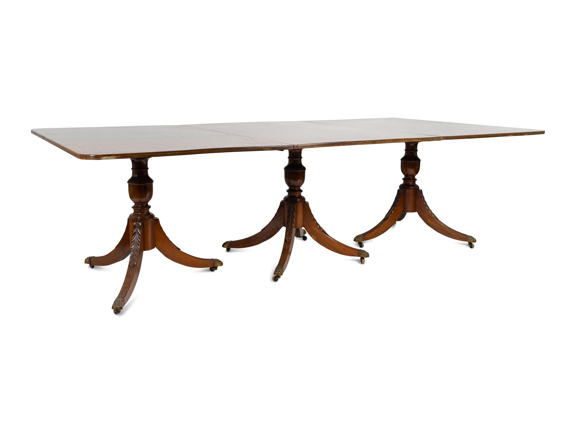 A Regency Style Mahogany Three Pedestal Dining Table — EARLY 20TH CENTURY