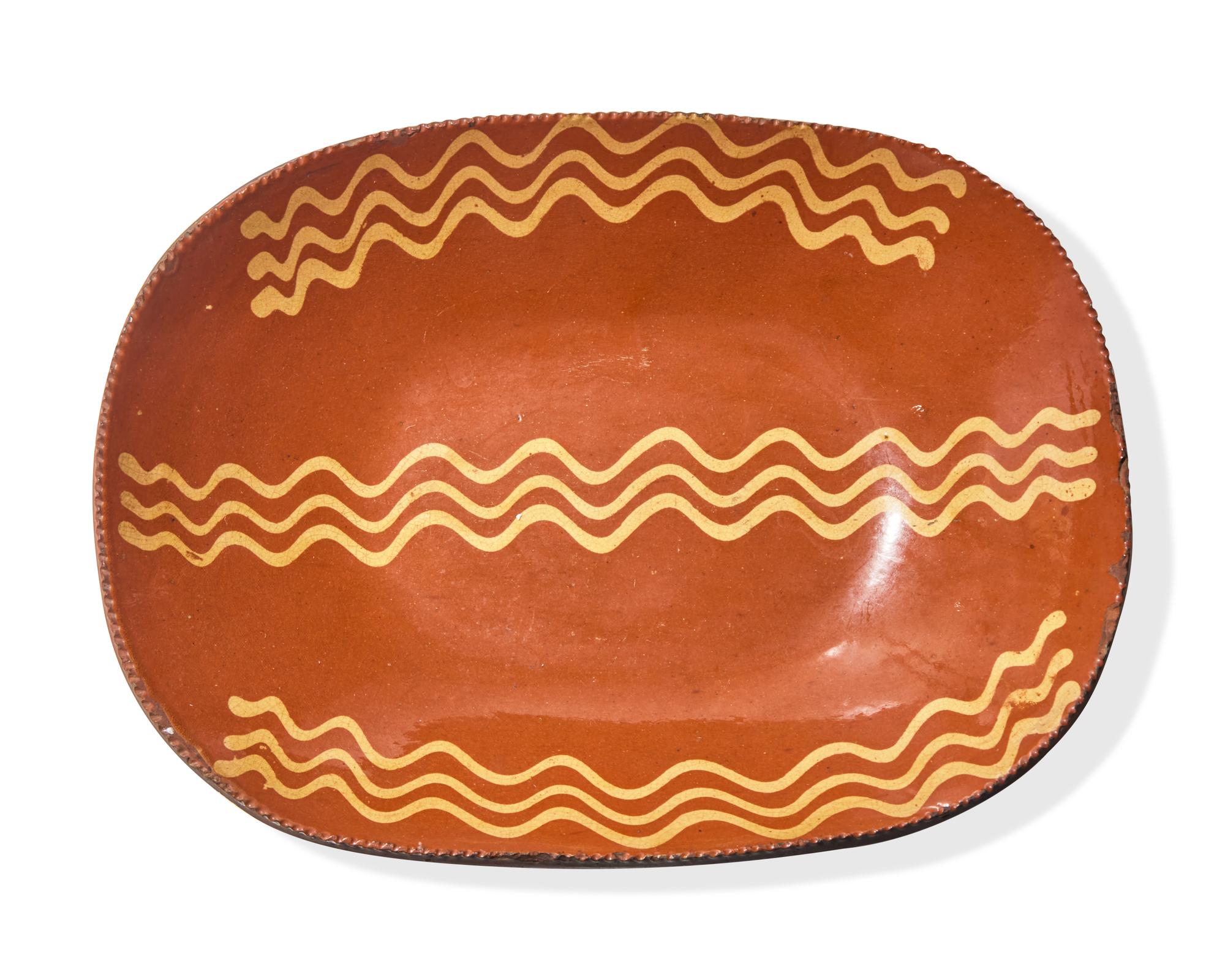 A Glazed and Slip-Decorated Redware Loaf Dish, Pennsylvania