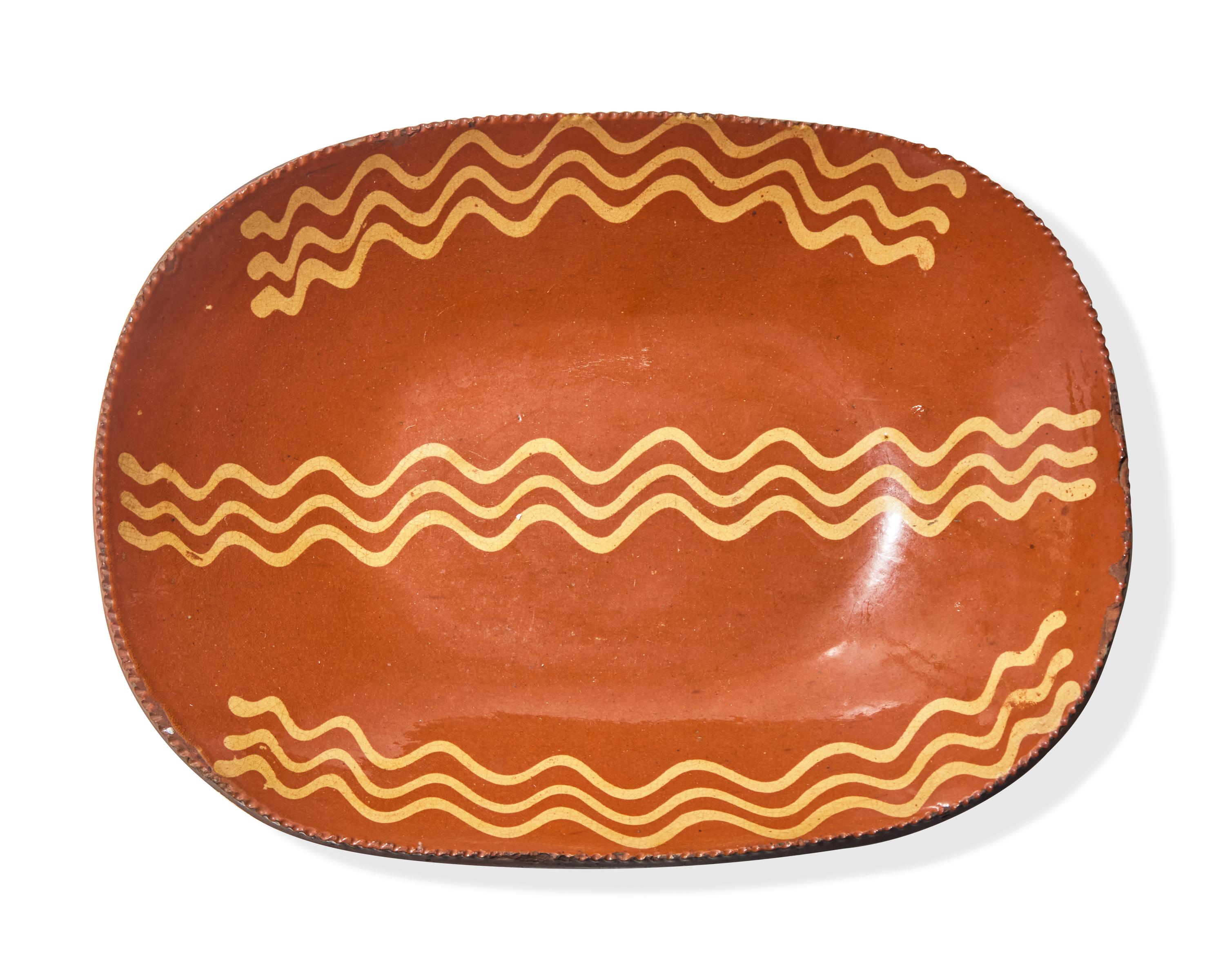 A Glazed and Slip-Decorated Redware Loaf Dish, Pennsylvania