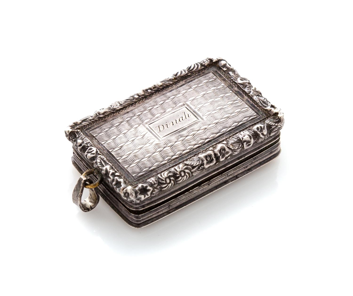 A George IV Silver Vinaigrette, Maker's mark T&WS, Birmingham, 1822, having a floral and foliate decorated border centered by a cartouc