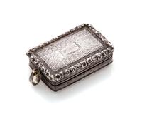 A George IV Silver Vinaigrette, Maker's mark T&WS, Birmingham, 1822, having a floral and foliate decorated border centered by a cartouc