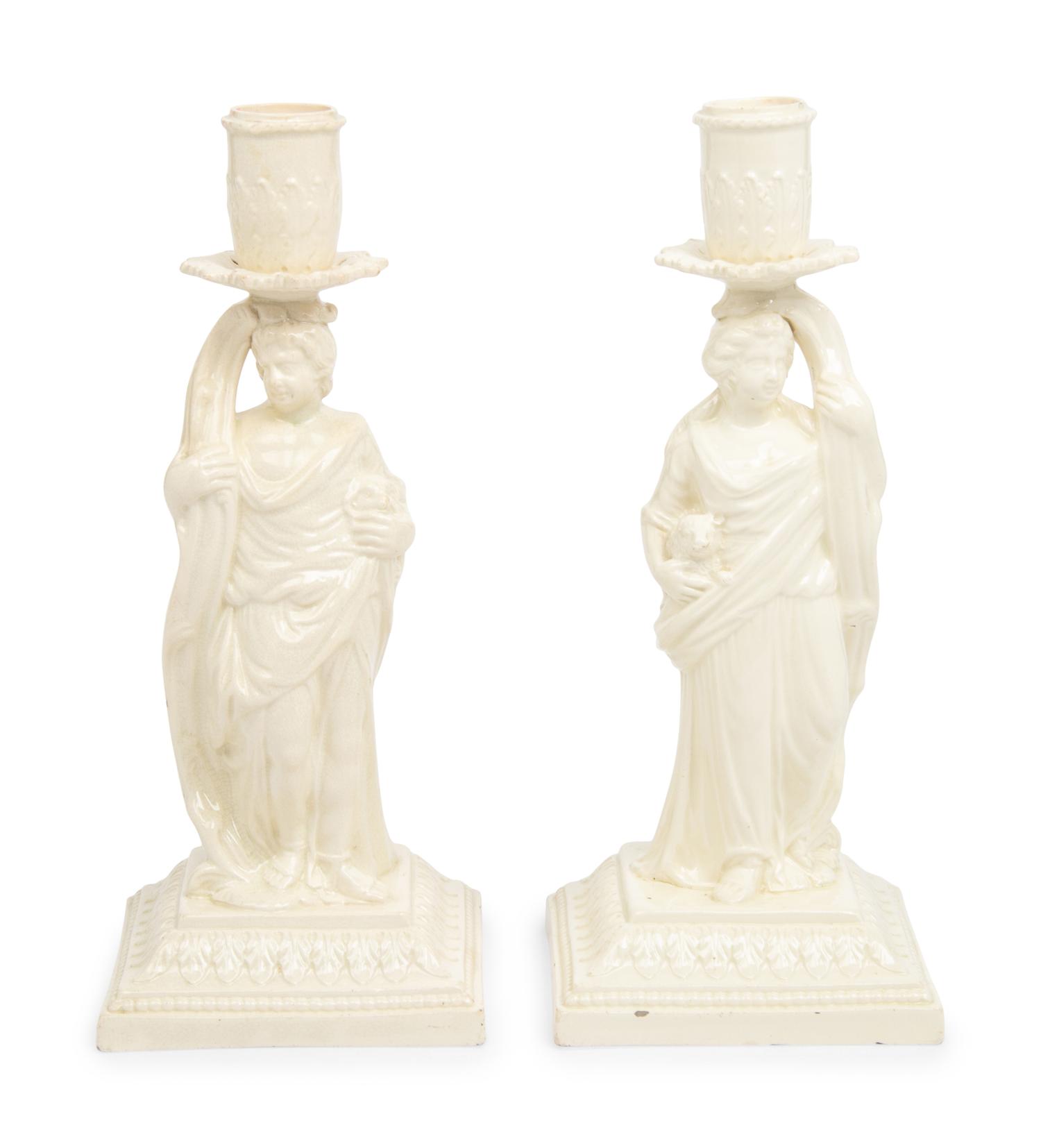 A Pair of English Creamware Figural Candlesticks