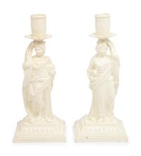 A Pair of English Creamware Figural Candlesticks