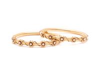 PAIR OF YELLOW GOLD AND DIAMOND BANGLE BRACELETS