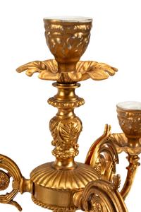 A Pair of Gilt Metal and Porcelain Figural Four-Light Candelabra
