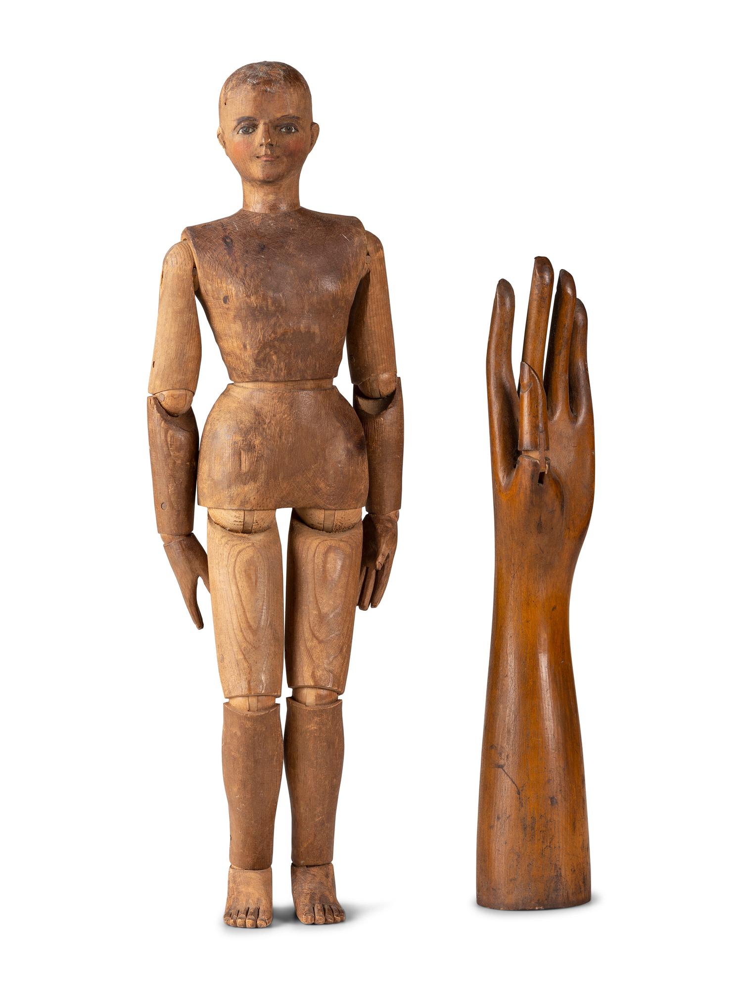 An Articulated Wooden Mannequin and a Carved Wooden Hand with Articulated Thumb