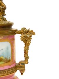 A Pair of Gilt Bronze Mounted Sèvres Style Porcelain Urns Mounted as Lamps