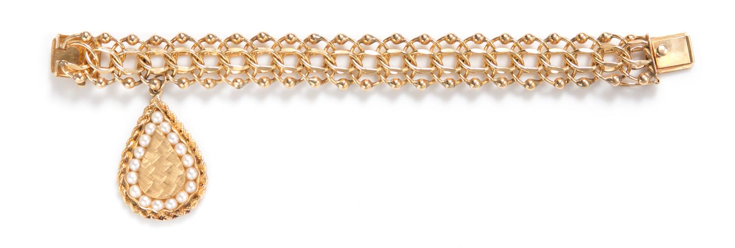 A 14 Karat Yellow Gold and Cultured Pearl Charm Bracelet, 44.40 dwts.