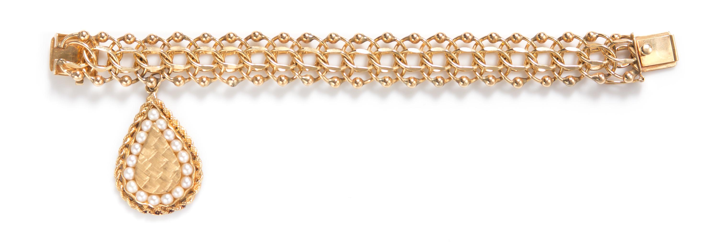 A 14 Karat Yellow Gold and Cultured Pearl Charm Bracelet, 44.40 dwts.