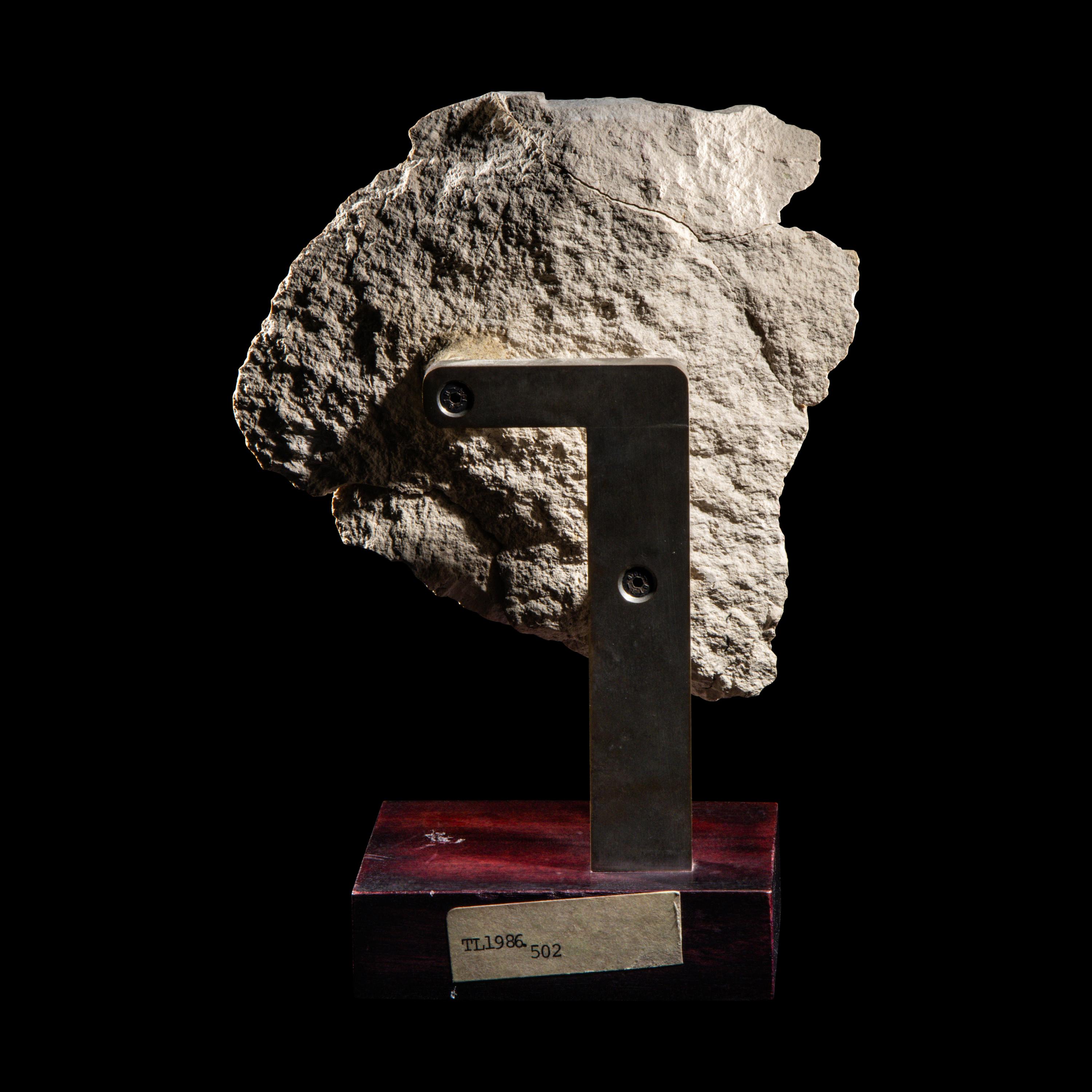 An Egyptian Limestone Relief Fragment with a Nile God