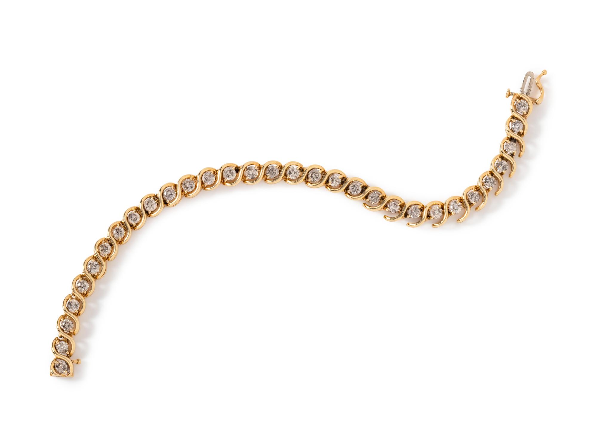 A 14 Karat Yellow Gold and Diamond Bracelet,