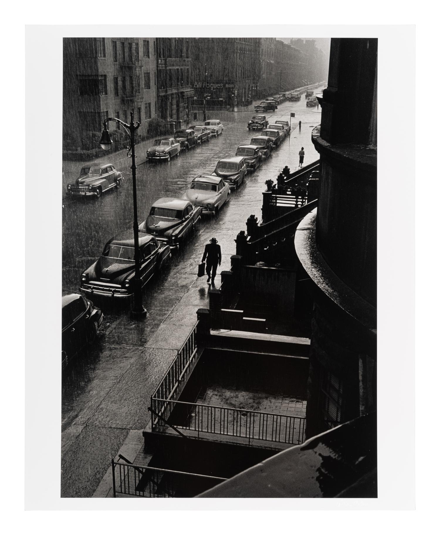 Ruth Orkin (1921-1985) Man in Rain, West 88th Street, New York City, 1952