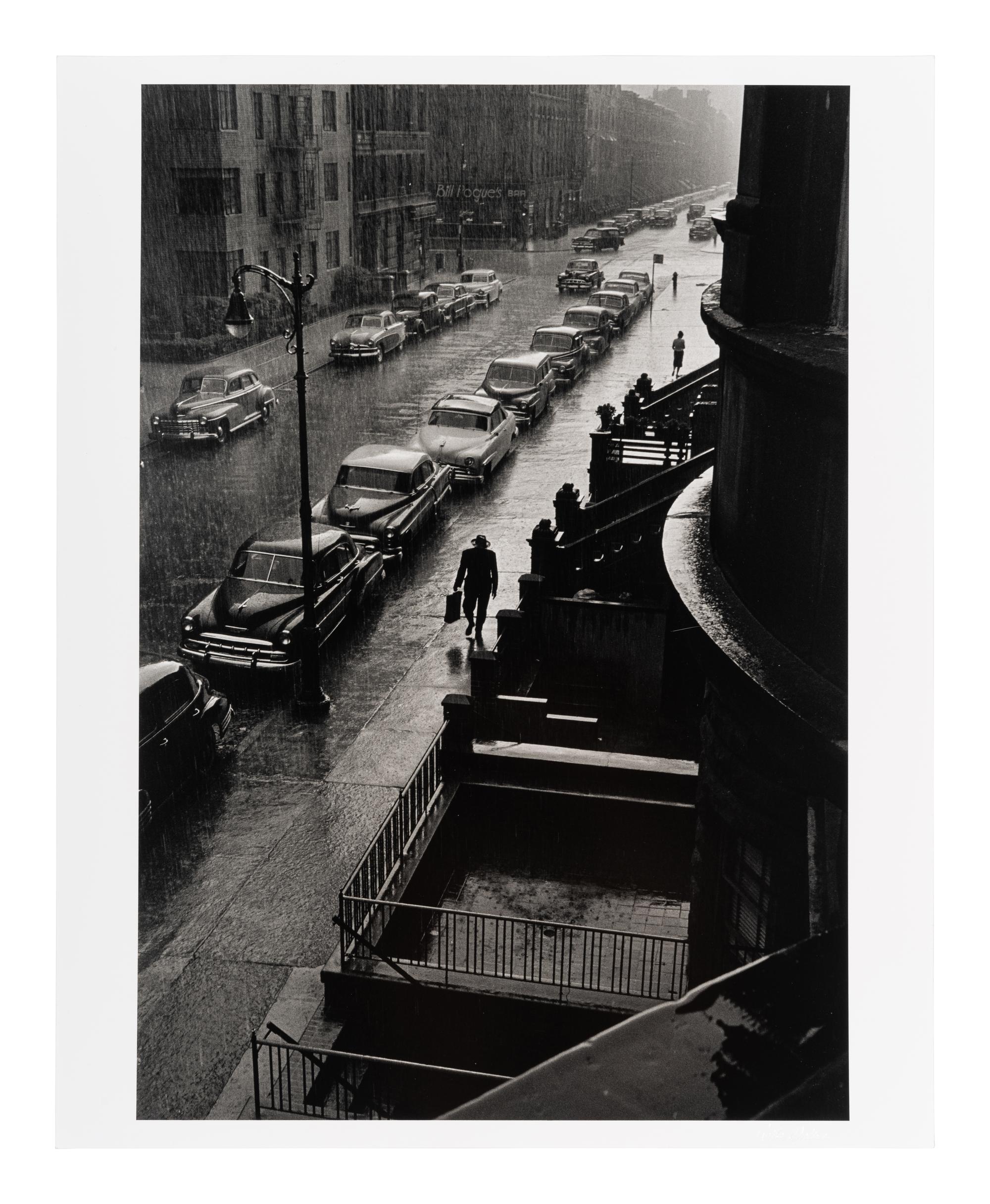 Ruth Orkin (1921-1985) Man in Rain, West 88th Street, New York City, 1952