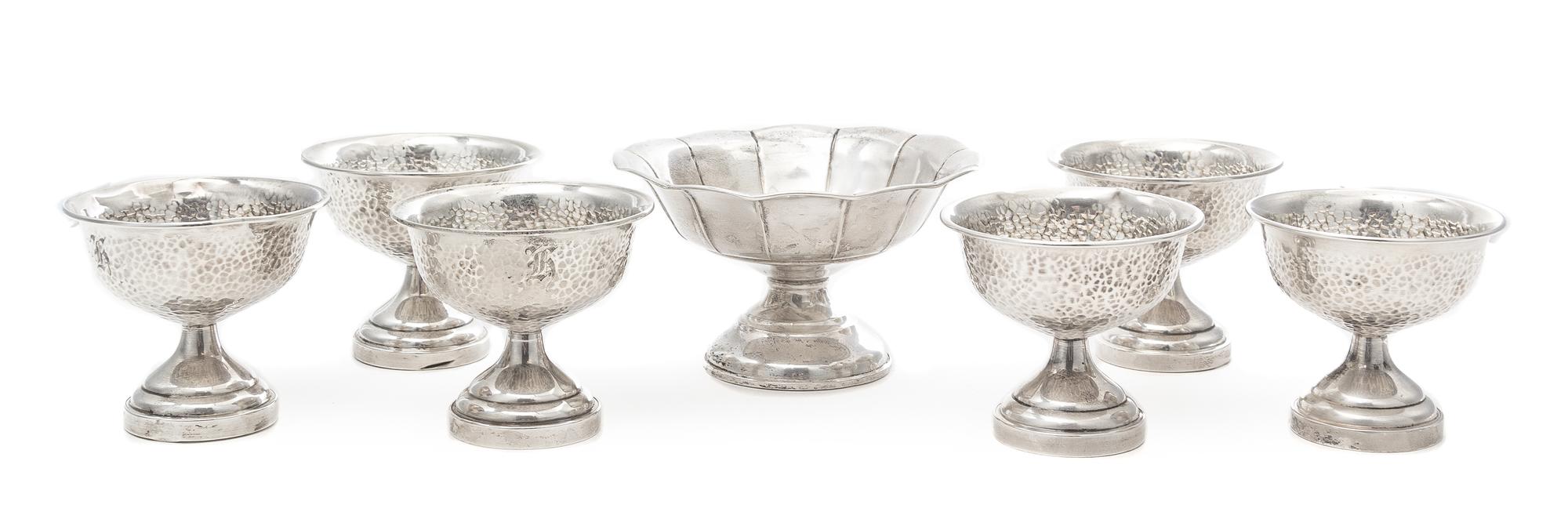 A Set of Six American Silver Sherbets, Various Makers, each having a spot hammered finish and engraved with a monogram, together with a