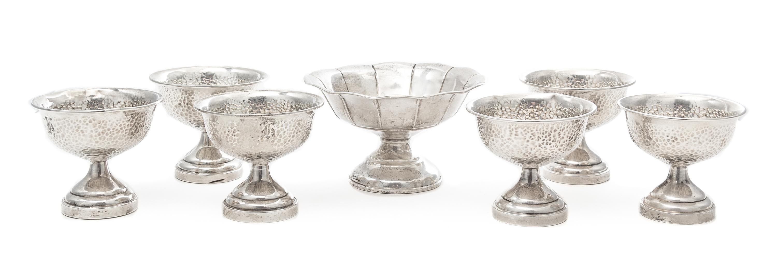 A Set of Six American Silver Sherbets, Various Makers, each having a spot hammered finish and engraved with a monogram, together with a