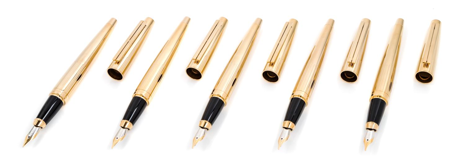 A Group of Five S.T. Dupont Gold-Plated Ellipsis Fountain Pens