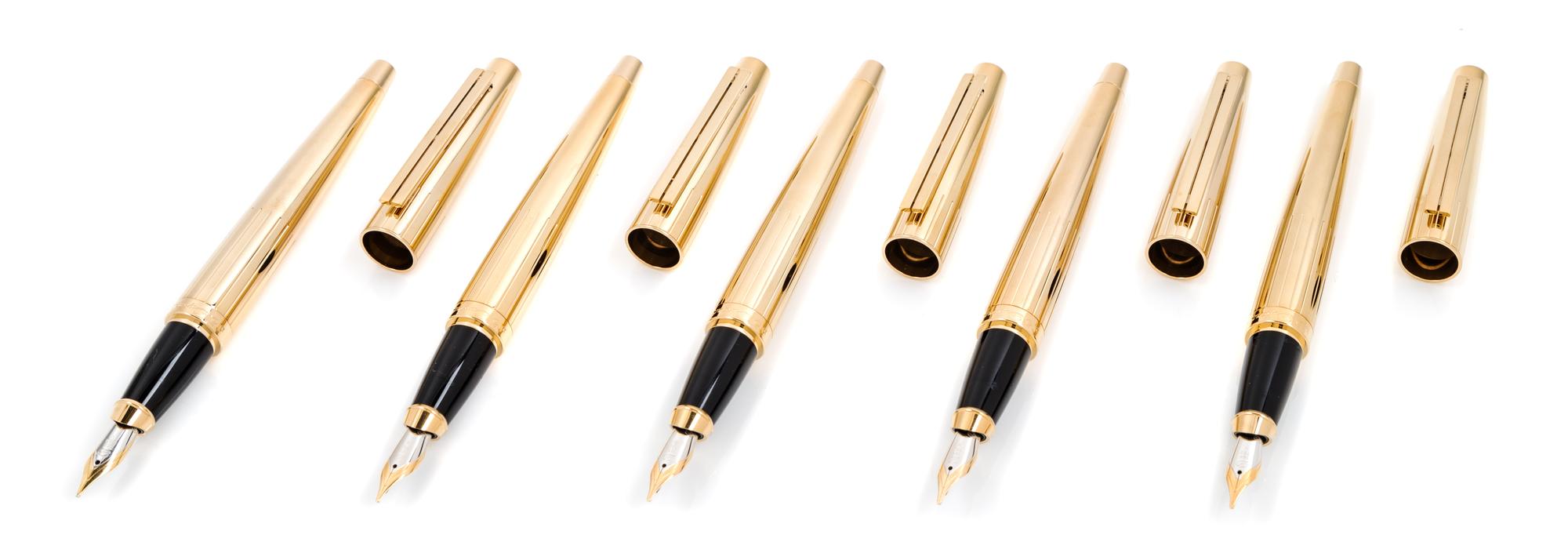 A Group of Five S.T. Dupont Gold-Plated Ellipsis Fountain Pens