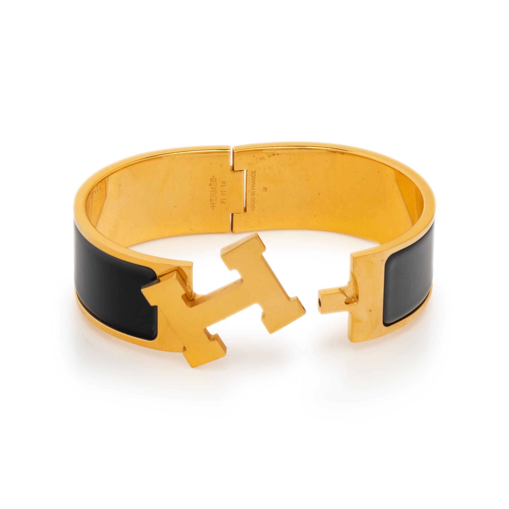 A Group of Three Costume Jewelry Pieces by Hermès and Chanel