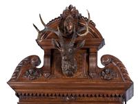 An Impressive Renaissance Revival Carved Walnut Tall Case Regulator Clock