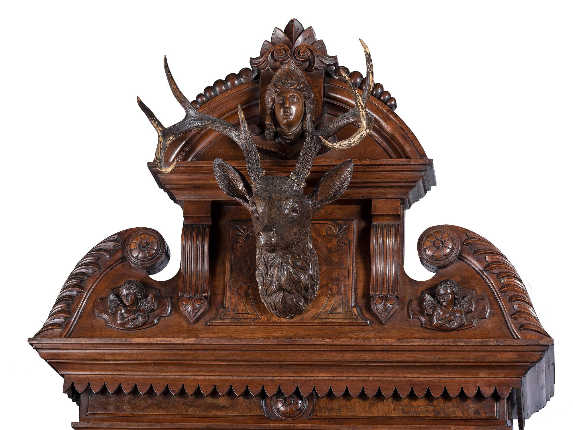 An Impressive Renaissance Revival Carved Walnut Tall Case Regulator Clock
