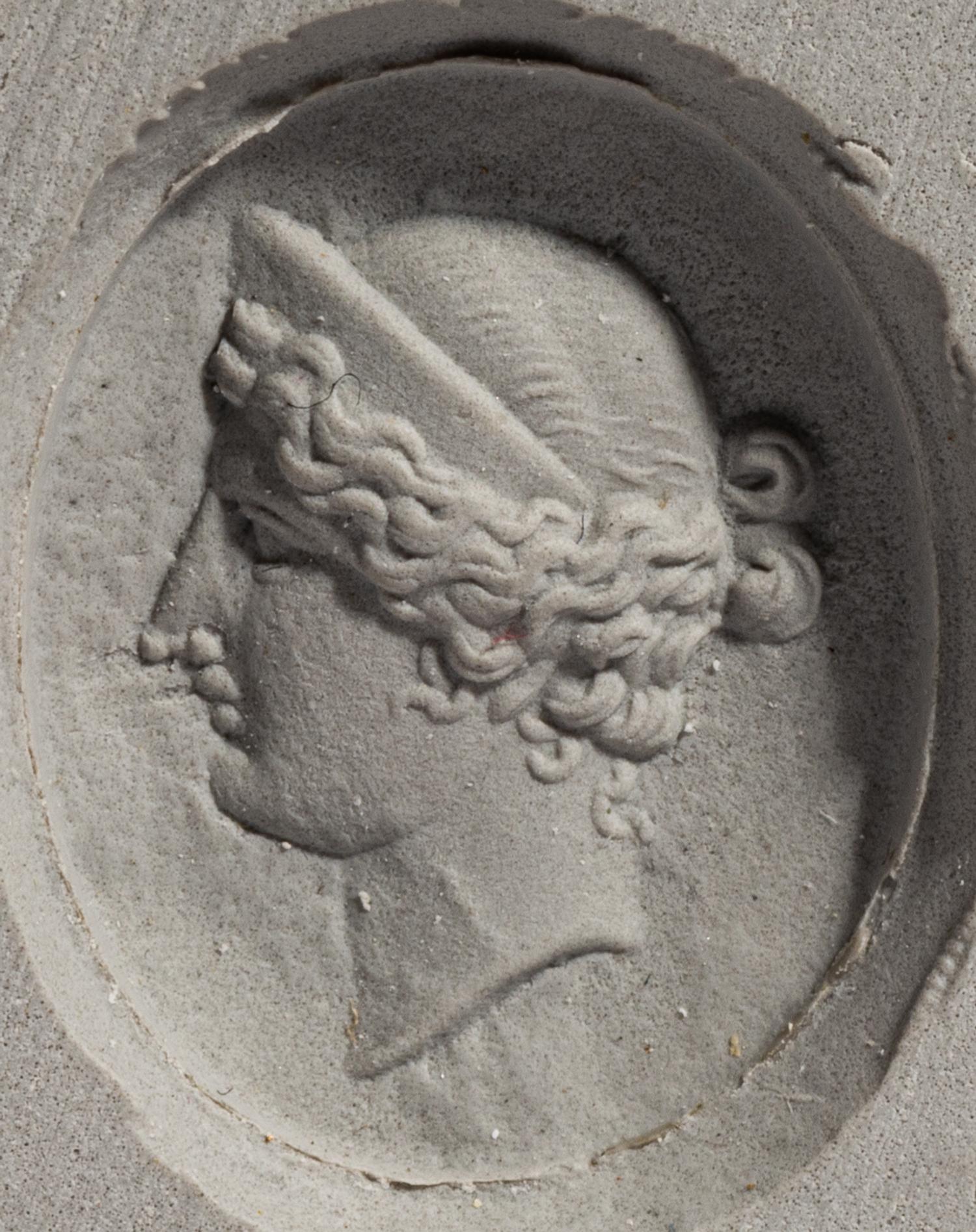 A Neoclassical Gold and Carnelian Finger Ring with the Portrait Head of a Woman