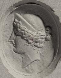 A Neoclassical Gold and Carnelian Finger Ring with the Portrait Head of a Woman