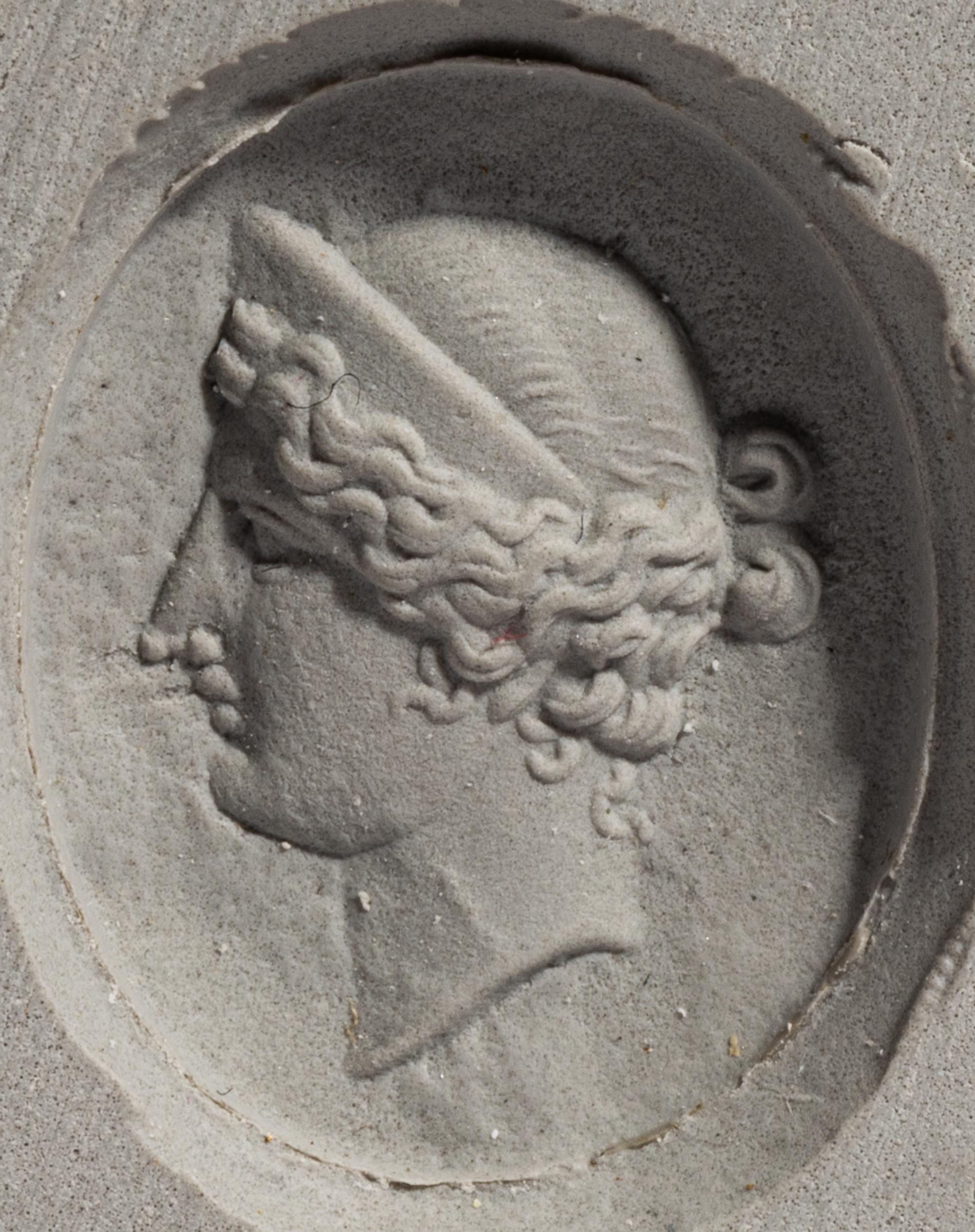 A Neoclassical Gold and Carnelian Finger Ring with the Portrait Head of a Woman