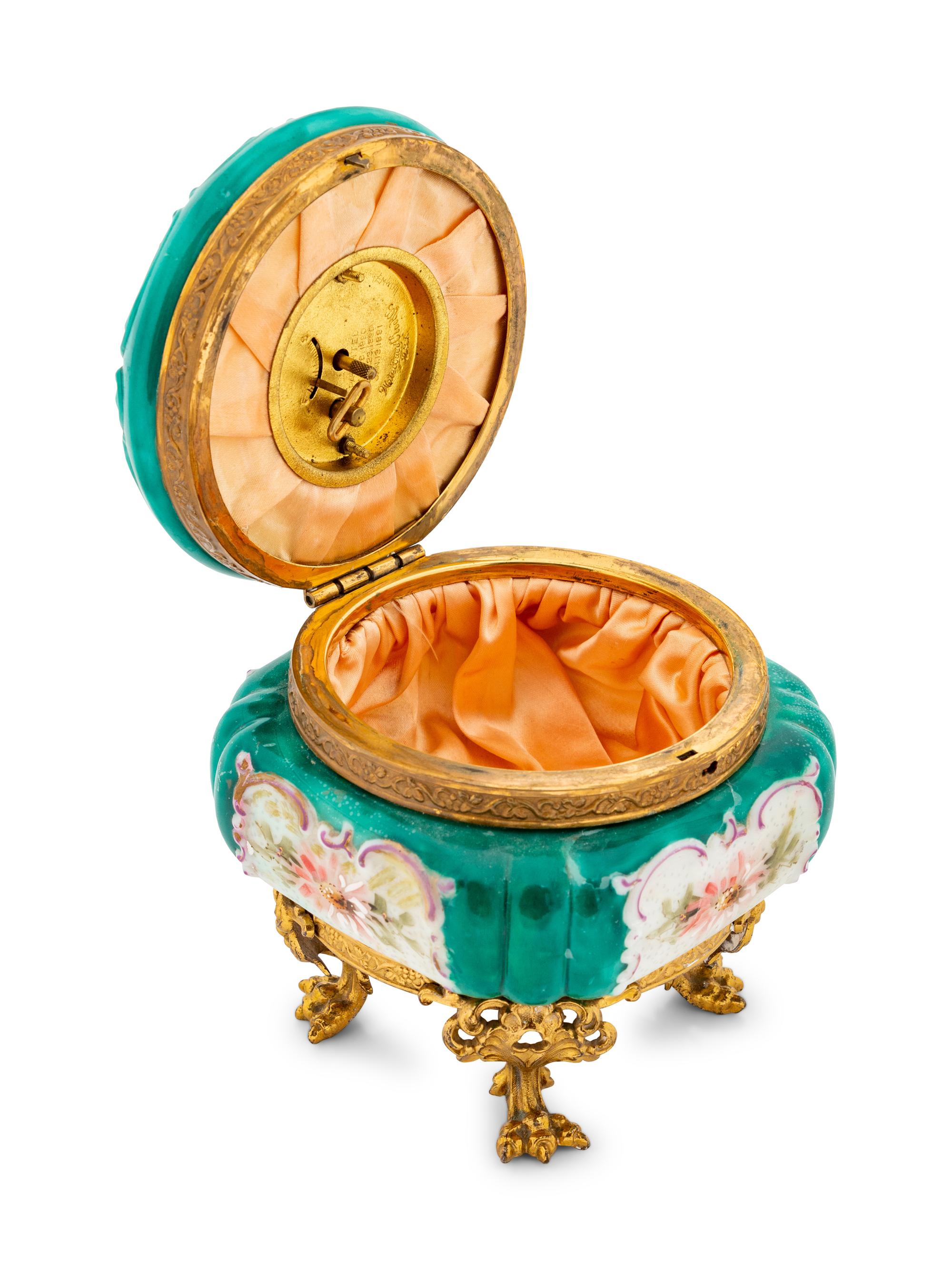 A Wavecrest Glass and Gilt Metal Footed Jewel Box with Clock
