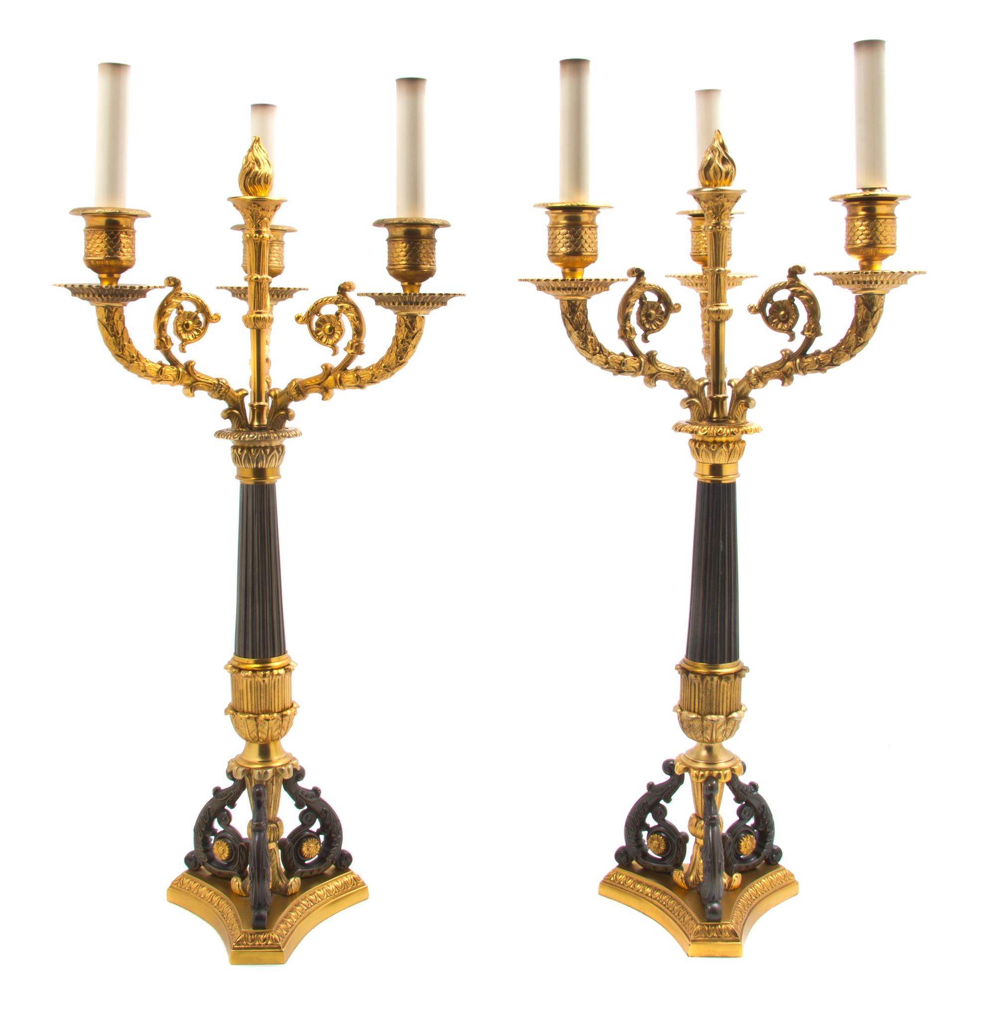 A Pair of Napoleon III Style Gilt and Patinated Bronze Three-Light Candelabra, Height overall 29 1/2 inches.
