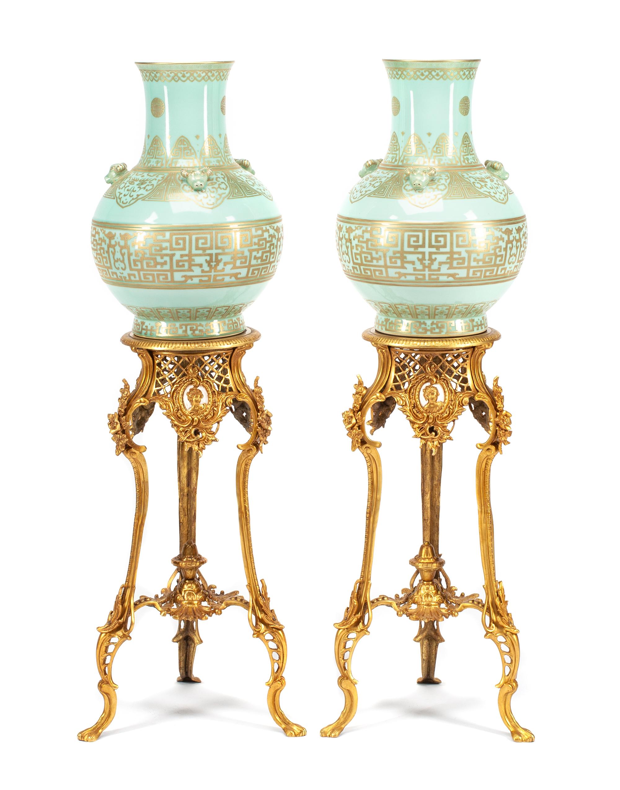 A Pair of Chinese Gilt Decorated Celadon Glazed Porcelain Vases and Gilt Bronze Pedestals Height of porcelain 20 inches; height of pede