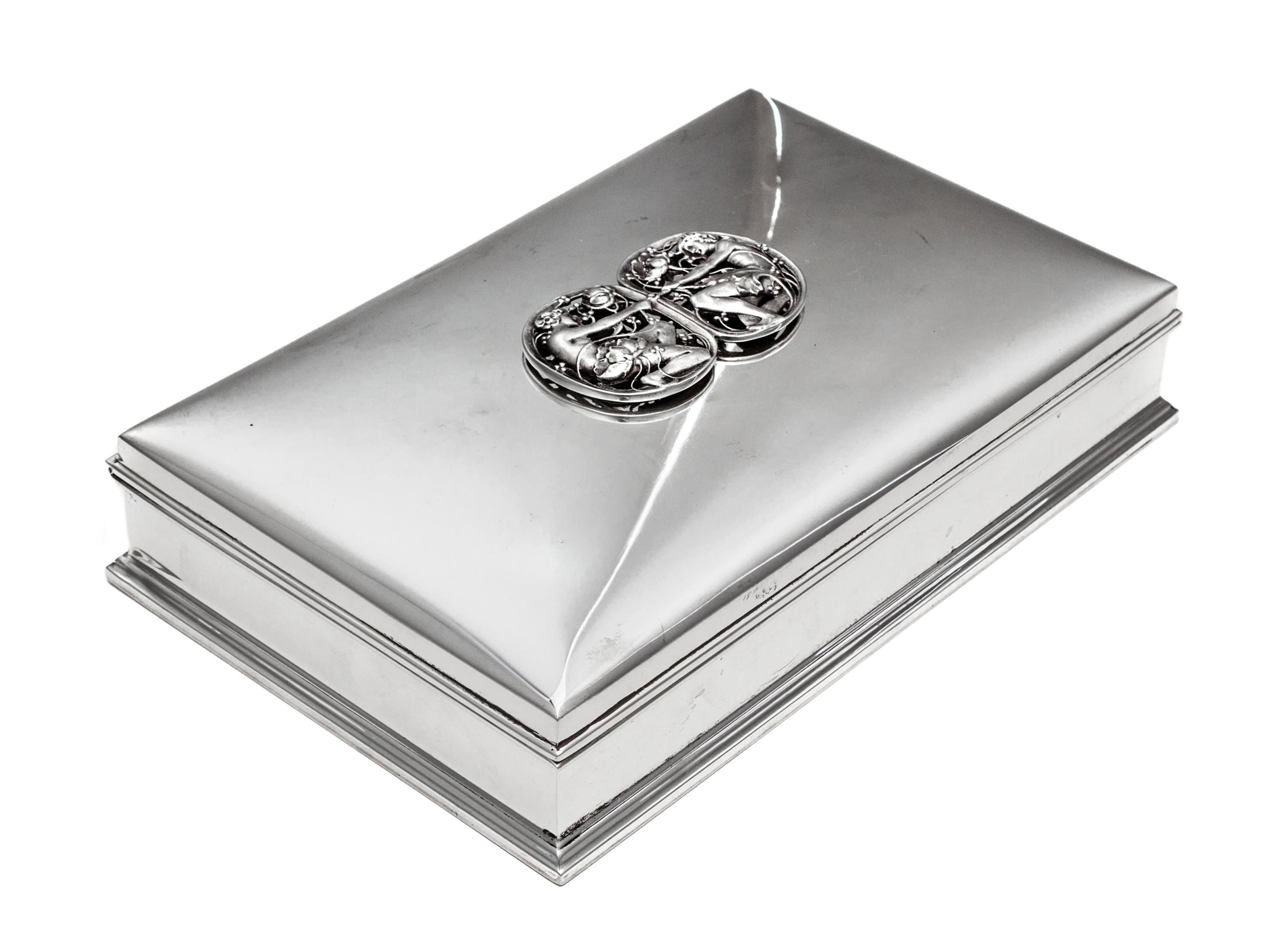 An American Silver Jewelry Casket, Gorham Mfg. Co., Providence, RI, of rectangular form, the lid with an applique depicting two opposin