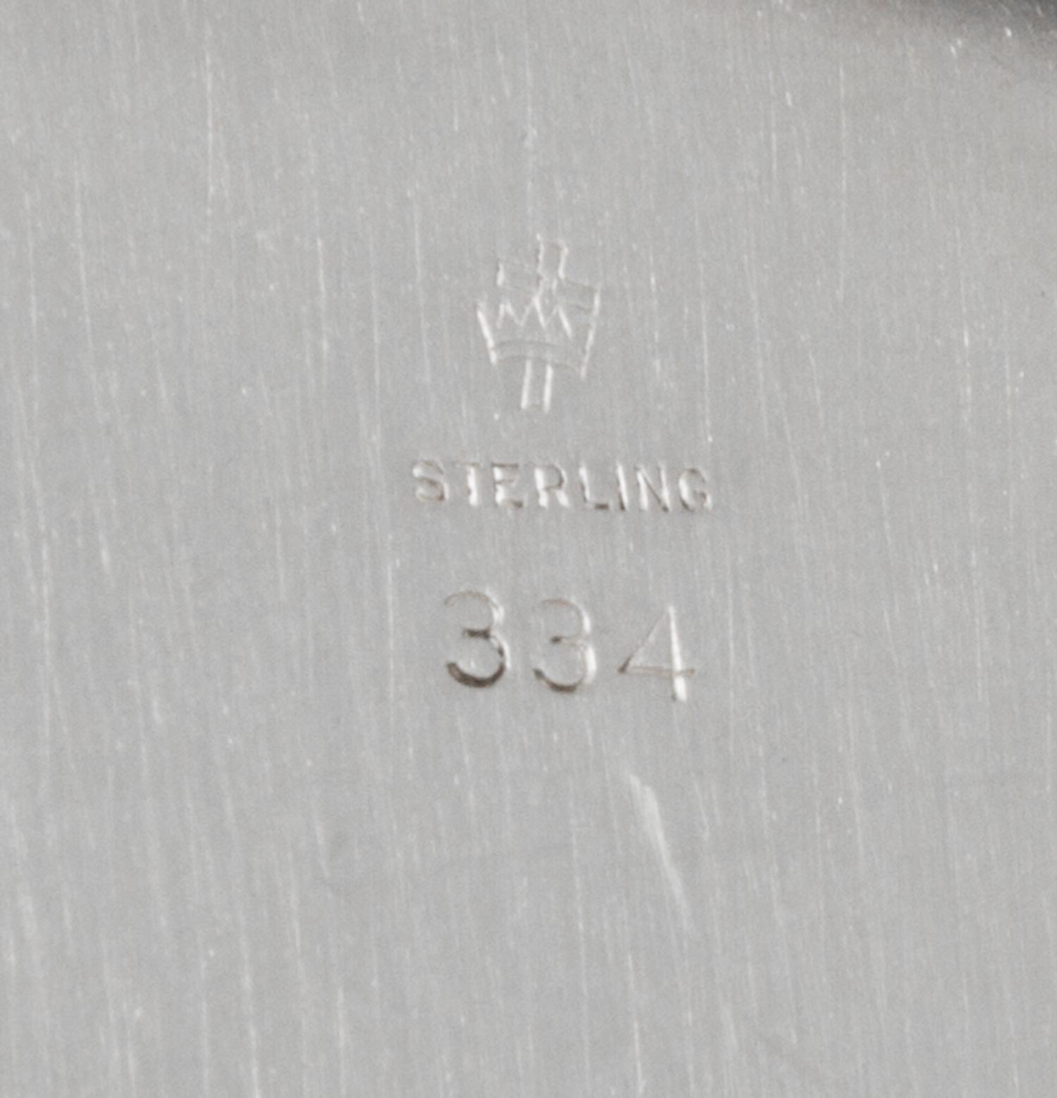 A Set of Twelve American Silver Bread Plates, Manchester Silver Co., Providence, RI, 20th Century, each with a reeded edge.