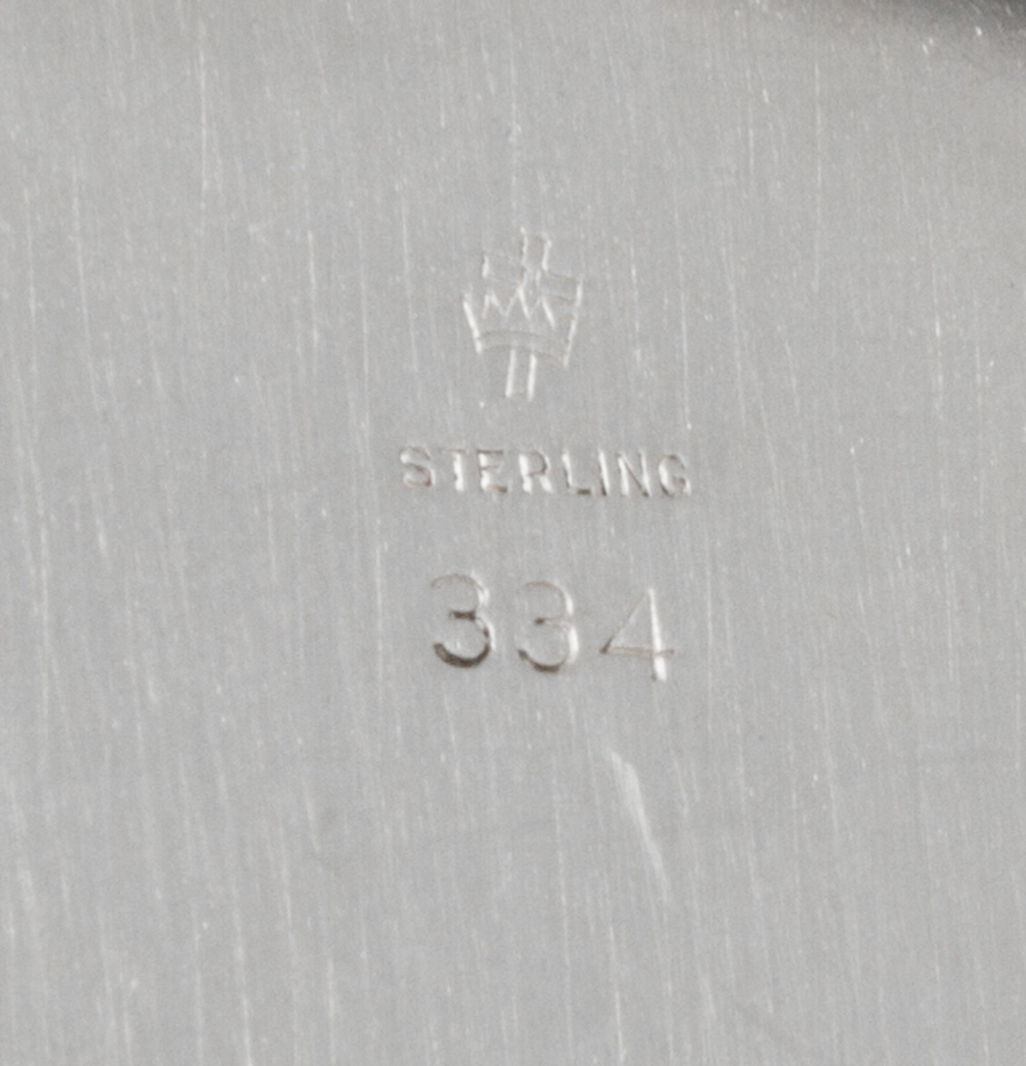 A Set of Twelve American Silver Bread Plates, Manchester Silver Co., Providence, RI, 20th Century, each with a reeded edge.