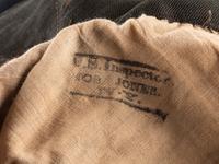 [CIVIL WAR]. A collection of items attributed to Thomas W. Johnson, Co. K, 4th Delaware Infantry, incl. frock coat, cap, belt rig, and cartridge box.