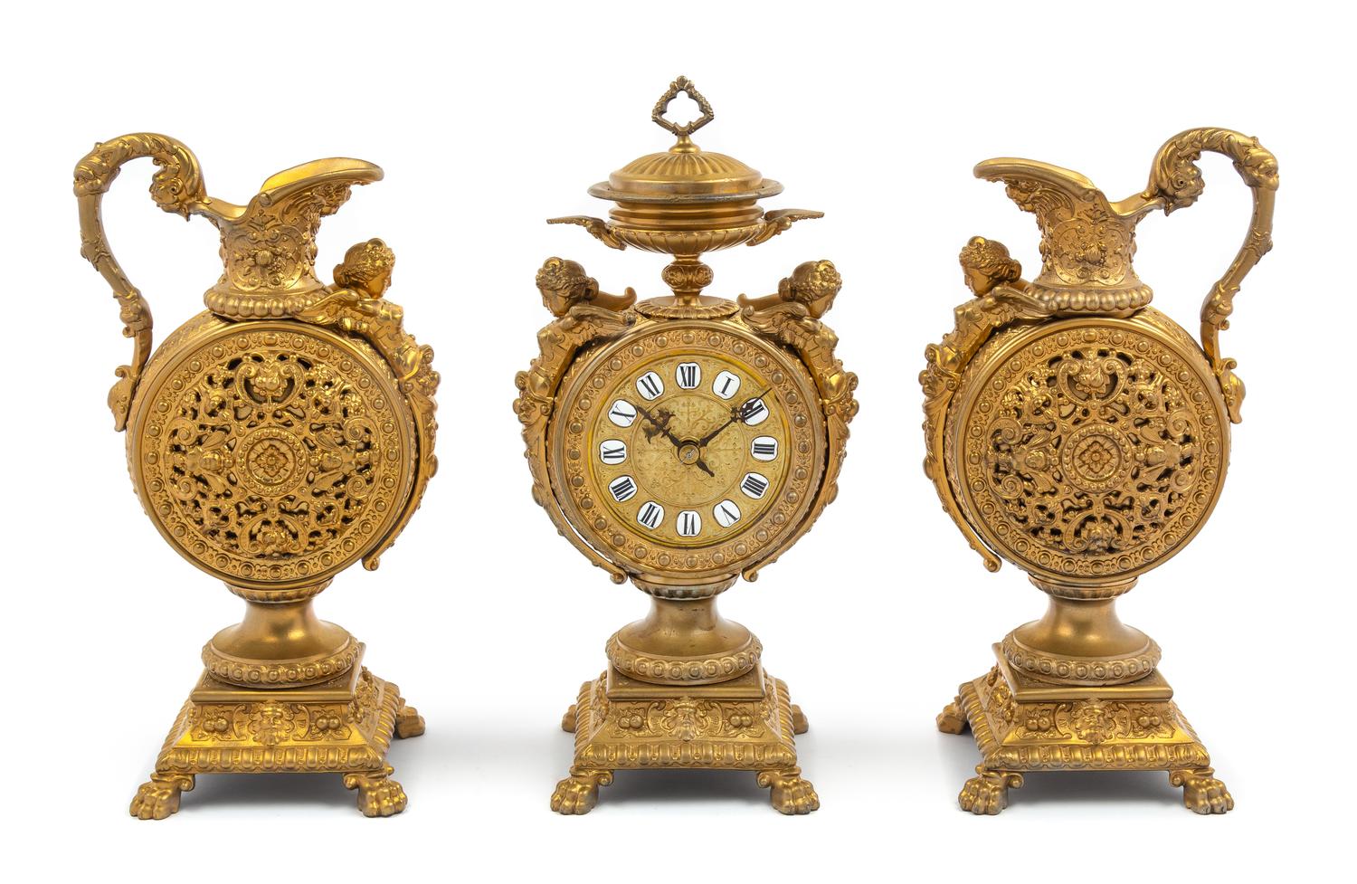 A French Neoclassical Gilt Metal Clock Garniture Height of mantel clock 16 x width 7 x depth 4 1/2 inches. — LATE 19TH CENTURY