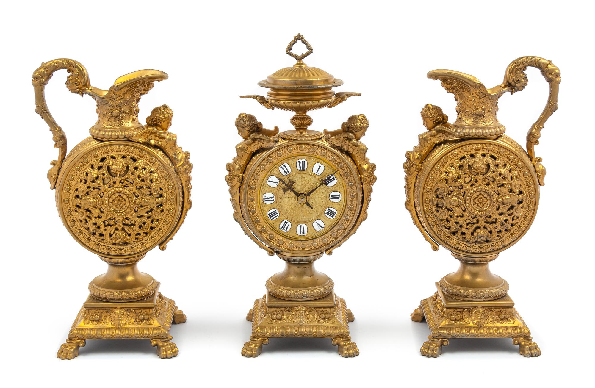 A French Neoclassical Gilt Metal Clock Garniture Height of mantel clock 16 x width 7 x depth 4 1/2 inches. — LATE 19TH CENTURY