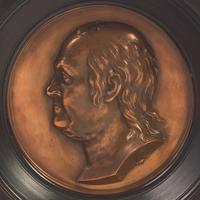 After Jean-Baptiste Nini (Italian, 1717-1786), A Profile Portrait Bas-Relief Plaque of Benjamin Franklin