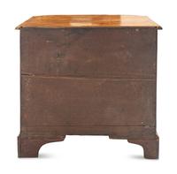 A George III Bookmatch-Veneered Bowfront Chest of Drawers