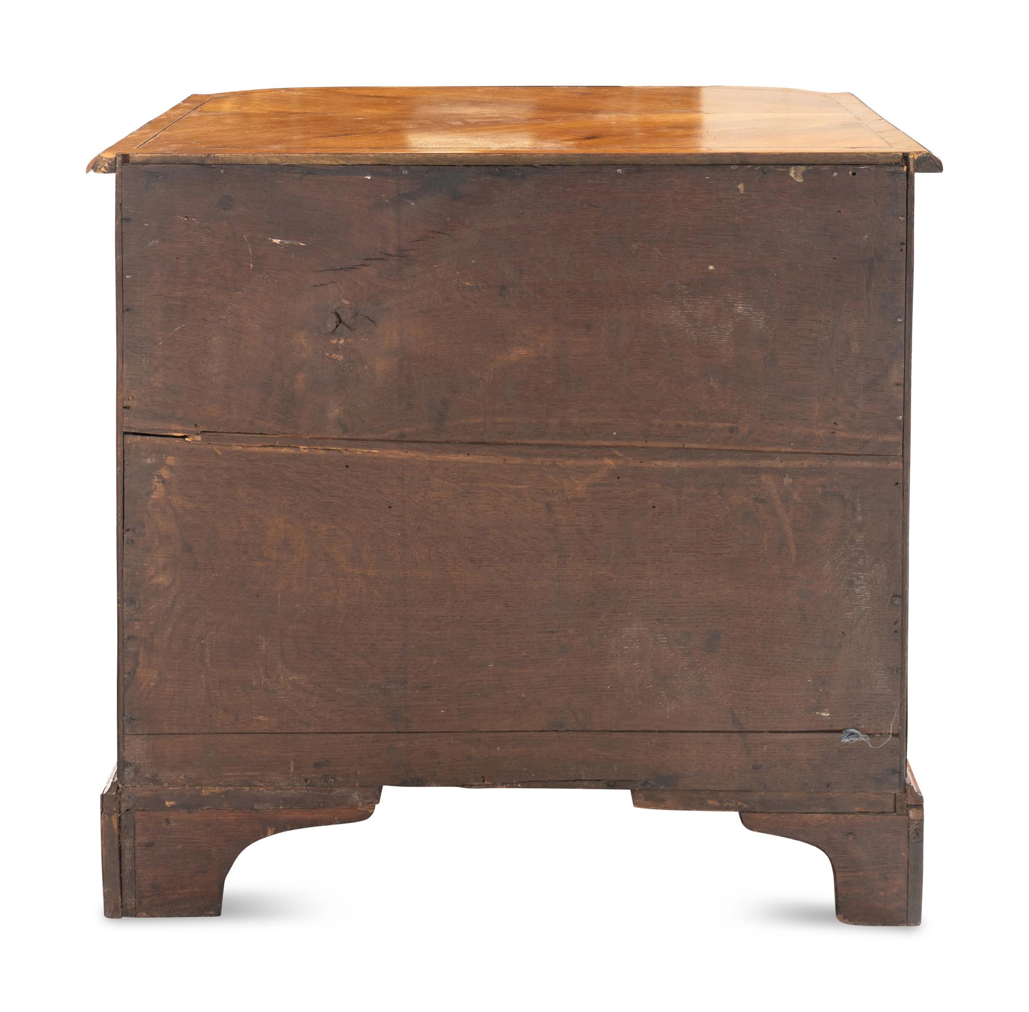 A George III Bookmatch-Veneered Bowfront Chest of Drawers