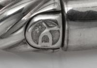 A Sterling Silver, 18 Karat Yellow Gold, Peridot and Diamond 'Cable' Bangle Bracelet, David Yurman, 15.00 dwts.