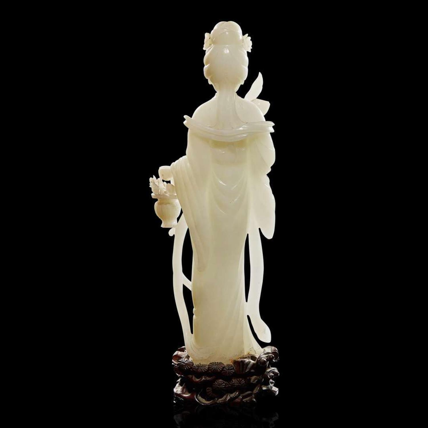 A Chinese carved white jade figure of a meiren 白玉雕美人 19th/early 20th century ????????