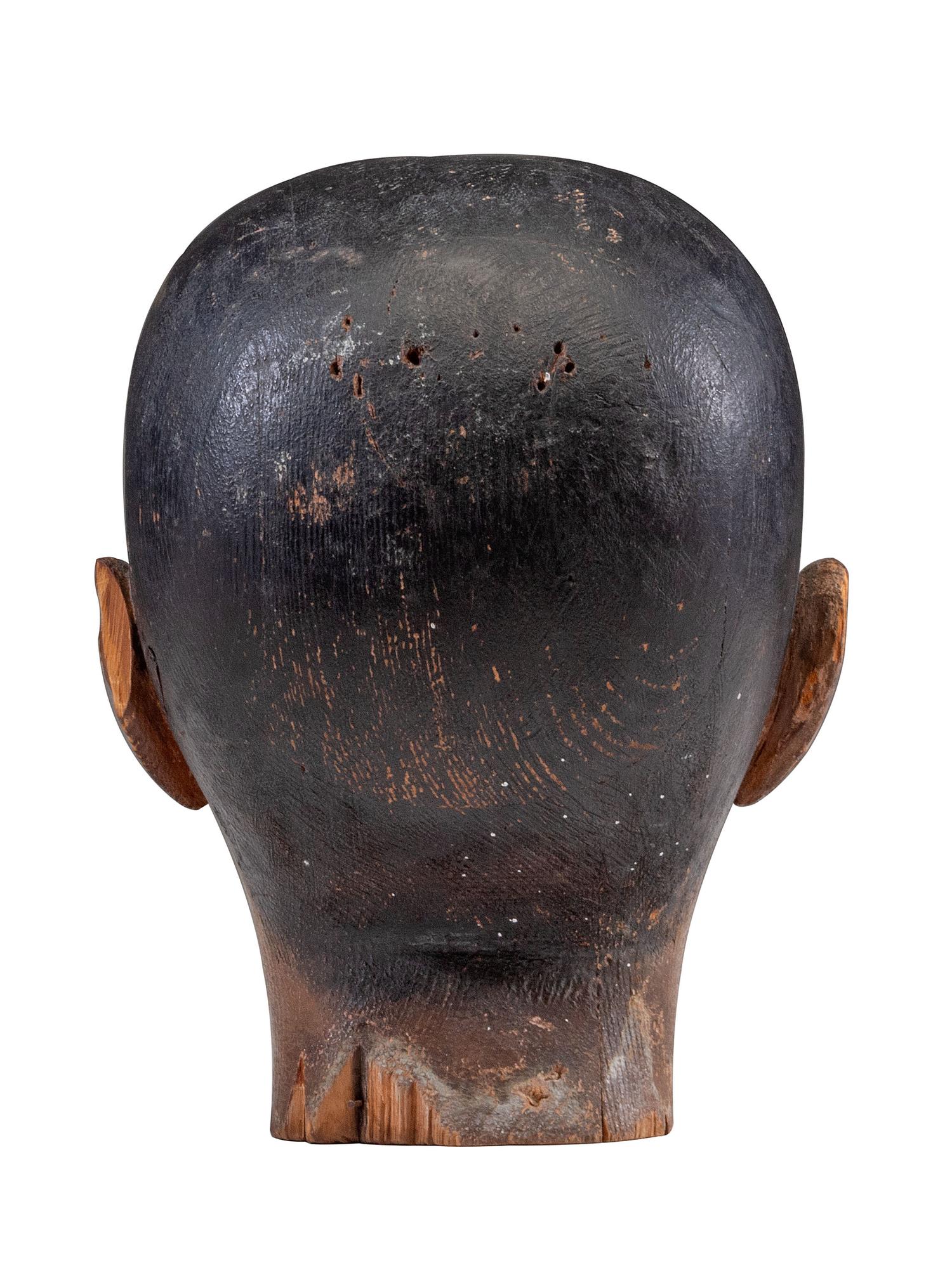 A Folk Art Carved and Painted Pine Carnival Head